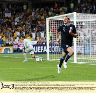 Englands Andy Carroll celebrates scoring his sides opening goal..Euro 2012 Sweden v England, Olympic Stadium, Kiev, 15th June 2012. Pic David Klein SPORTIMAGE EDITORIAL USE ONLY. No use with unauthorised audio, video, data, fixture lists, club league logos or live services. Online in-match use limited to 120 images, no video emulation. No use in betting, games or single club league player publications.
