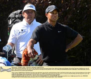Tiger Woods and Phil Mickelson wait to hit on the 12th tee box during the second round of the 112th U.S. Open at the Olympic Club in San Francisco, California on June 15, 2012. Tiger finished even for the day and is currently tied for first place at one-under-par with a 139.  SFP20120615343