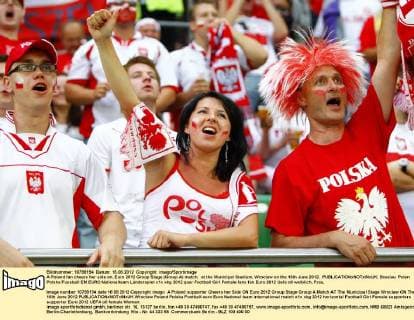 A Poland fan cheers her side on..Euro 2012 Group Stage (Group A) match, at the Municipal Stadium, Wroclaw on the 16th June 2012. EDITORIAL USE ONLY. No use with unauthorised audio, video, data, fixture lists, club league logos or live services. Online in-match use limited to 120 images, no video emulation. No use in betting, games or single club league player publications.