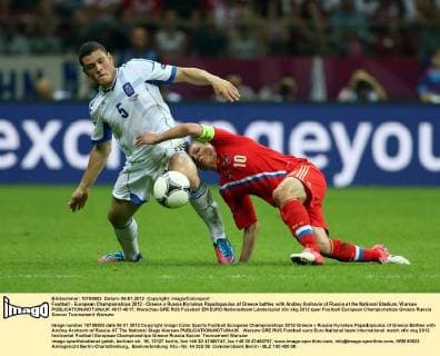 Football - European Championships 2012 - Greece v Russia Kyriakos Papadopoulos of Greece battles with Andrey Arshavin of Russia at the National Stadium, Warsaw  4017-4017