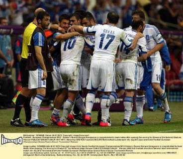Football - European Championships 2012 - Greece v Russia Giorgos Karagounis is congratulated by team mates after opening the scoring for Greece at the National Stadium, Warsaw  4017-4017