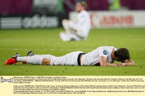 A dejected Sebastian Boenisch of Poland..Euro 2012 Group Stage (Group A) match, Czech Republic v Poland at the Municipal Stadium, Wroclaw, Poland on the 16th June 2012. Pic Jake Badger SPORTIMAGE... EDITORIAL USE ONLY. No use with unauthorised audio, video, data, fixture lists, club league logos or live services. Online in-match use limited to 120 images, no video emulation. No use in betting, games or single club league player publications.