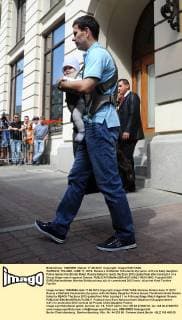 WARSAW, POLAND. JUNE 17, 2012. Russia s midfielder Konstantin Zyryanov with his baby daughter Polina leaves the Bristol Hotel. Russia failed to reach the Euro 2012 quaterfinal after losing 0-1 in a Group Stage match against Greece.  RE10156C