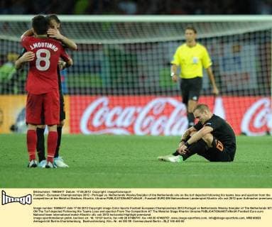 Football - European Championships 2012 - Portugal vs. Netherlands Wesley Sneijder of the Netherlands sits on the turf dejected following his teams loss and ejection from the competition at the Metalist Stadium, Kharkiv, Ukraine 