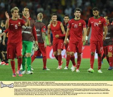 Football - European Championships 2012 - Portugal vs. Netherlands Christiano Ronaldo of Portugal celebrates with his team mates at the final whistle following their progression to the quarter finals at the Metalist Stadium, Kharkiv, Ukraine 