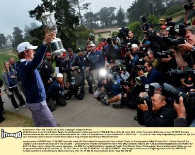 Webb Simpson holds the U.S. Open Trophy for photographers after winning the 112th U.S. Open at the Olympic Club in San Francisco, California on June 17, 2012. Simpson finished one-over-par with a four day combined total of 281.  SFP20120617133