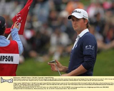 Webb Simpson glances at the leader board after scoring par on the 18th hole in the final round of the U.S. Open at the Olympic Club in San Francisco on June 17, 2012. He was tied with Jim Furyk at the time. Simpson won by a stroke.  SFP2012061727