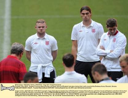 Football - Euro 2012 - England Training Wayne Rooney and Andy Carroll of England look glum during their walk around at the Donbass Arena, Donetsk, Ukraine 