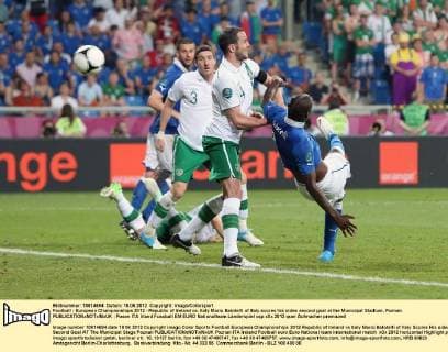 Football - European Championships 2012 - Republic of Ireland vs. Italy Mario Balotelli of Italy scores his sides second goal at the Municipal Stadium, Poznan 