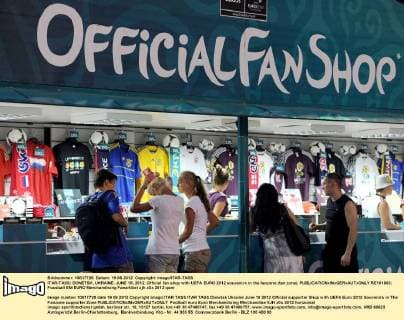 ITAR-TASS: DONETSK, UKRAINE. JUNE 19, 2012. Official fan shop with UEFA EURO 2012 souvenirs in the fanzone (fan zone).  RE101663
