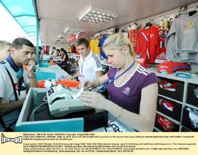 ITAR-TASS: DONETSK, UKRAINE. JUNE 19, 2012. Shop with UEFA EURO 2012 souvenirs in the fanzone (fan zone).  RE10166B