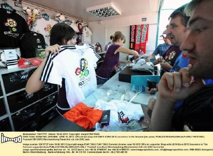 ITAR-TASS: DONETSK, UKRAINE. JUNE 19, 2012. Official fan shop with UEFA EURO 2012 souvenirs in the fanzone (fan zone).  RE10166C