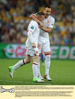 Football - Euro 2012 - England vs. Ukraine England s Wayne Rooney celebrates scoring their opening goal with John Terry at the Donbass Arena, Donetsk, Ukraine 
