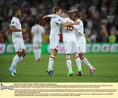 Football - Euro 2012 - England vs. Ukraine England s Wayne Rooney celebrates scoring their opening goal with his team mates at the Donbass Arena, Donetsk, Ukraine 