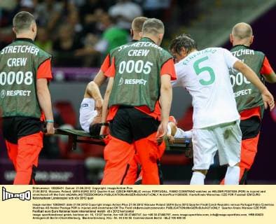 21.06.2012. Warsaw, Poland. UEFA EURO 2012 Quarter-final. CZECH REPUBLIC versus PORTUGAL. FABIO COENTRAO watches as HELDER POSTIGA (POR) is injured and stretchered off the field xADAMxJASTRZEBOWSKIx  ActionPlus11293635