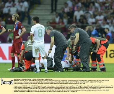 WARSAW, June 21, 2012 -- Helder Postiga (Down) of Portugal is injured during the quarterfinal match between the Czech Republic and Portugal at the Euro 2012 football championships in Warsaw, Poland, June 21, 2012. (Xinhua Wu Wei) (jyc) POLAND-WARSAW-EURO 2012 FOOTBALL CHAMPIONSHIPS-CZECH VS PORTUGAL 