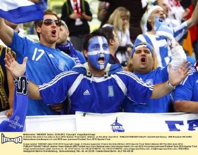 A Greece fan cheers his side on..Euro 2012 Quarter Final match, Gdansk, on the 22nd June 2012. EDITORIAL USE ONLY. No use with unauthorised audio, video, data, fixture lists, club league logos or live services. Online in-match use limited to 120 images, no video emulation. No use in betting, games or single club league player publications.