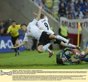 GDANSK, June 22, 2012 - Miroslav Klose (L) of Germany falls down during the quarterfinal match between Germany and Greece at the Euro 2012 football championships in Gdansk, Poland, June 22, 2012. EURO 2012 FOOTBALL CHAMPIONSHIPS 