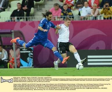 GDANSK, June 22, 2012 - Bastian Schweinsteiger (R) of Germany vies with Giorgos Samaras of Greece during the quarterfinal match between Germany and Greece at the Euro 2012 football championships in Gdansk, Poland, June 22, 2012. EURO 2012 FOOTBALL CHAMPIONSHIPS 