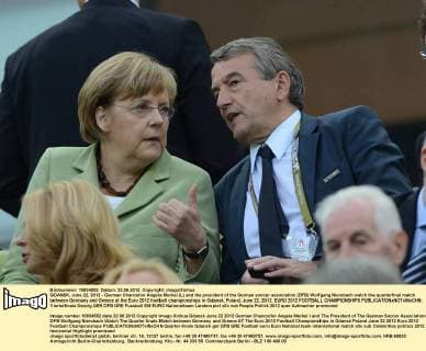 GDANSK, June 22, 2012 - German Chancellor Angela Merkel (L) and the president of the German soccer association (DFB) Wolfgang Niersbach watch the quarterfinal match between Germany and Greece at the Euro 2012 football championships in Gdansk, Poland, June 22, 2012. EURO 2012 FOOTBALL CHAMPIONSHIPS 