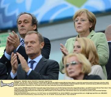 GDANSK, June 22, 2012 - German Chancellor Angela Merkel (Back R) and UEFA president Michel Platini (Back L) watch the quarterfinal match of Germany at the Euro 2012 football championships in Gdansk, Poland, June 22, 2012. EURO 2012 FOOTBALL CHAMPIONSHIPS 