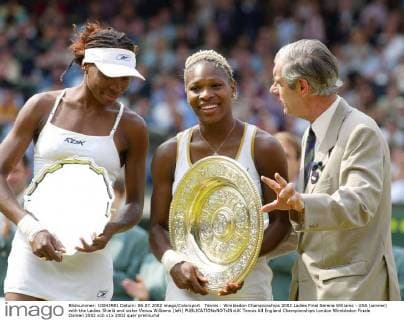 Tennis : Wimbledon Championships 2002 Ladies Final Serena Williams - USA (winner) with the Ladies Shield and sister Venus Williams (left) 