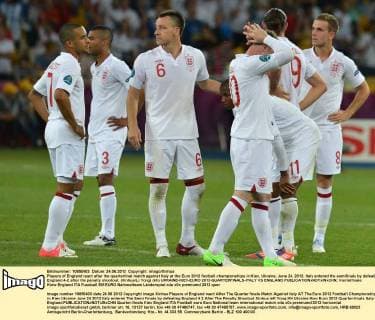 Players of England react after the quarterfinal match against Italy at the Euro 2012 football championships in Kiev, Ukraine, June 24, 2012. Italy entered the semifinals by defeating England 4-2 after the penalty shootout. (Xinhua Li Yong) (kh) UKRAINE-KIEV-EURO 2012-QUARTERFINALS-ITALY VS ENGLAND 