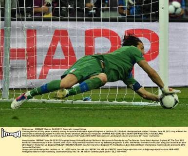 Gianluigi Buffon of Italy saves a penalty during the quarterfinal match against England at the Euro 2012 football championships in Kiev, Ukraine, June 24, 2012. Italy entered the semifinals by defeating England 4-2 after the penalty shootout. (Xinhua Li Yong) (lm) UKRAINE-KIEV-EURO 2012-QUARTERFINALS-ITALY VS ENGLAND 