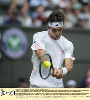 26.06.2012. The Wimbledon Tennis Championships 2012 held at The All England Lawn Tennis Club, London, England, UK. Thomaz Bellucci (BRA) - xDuncanxGrovex  ActionPlus17733