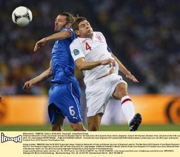 Federico Balzaretti of Italy and Steven Gerrard of England leap for the ball..Euro 2012 Quarter Final match, England v Italy at the Olympic Stadium, Kiev, Ukraine on the 24th June 2012. Pic Jake Badger SPORTIMAGE... EDITORIAL USE ONLY. No use with unauthorised audio, video, data, fixture lists, club league logos or live services. Online in-match use limited to 120 images, no video emulation. No use in betting, games or single club league player publications.