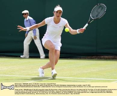 Spain s Maria Jose Sanchez returns in her match on the third day of the 2012 Wimbledon championships in London, June 27, 2012.  LON2012062705