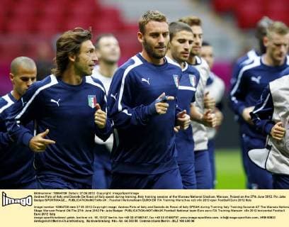 Andrea Pirlo of Italy and Daniele De Rossi of Italy speak during training..Italy training session at the Warsaw National Stadium, Warsaw, Poland on the 27th June 2012. Pic Jake Badger SPORTIMAGE... EDITORIAL USE ONLY. No use with unauthorised audio, video, data, fixture lists, club league logos or live services. Online in-match use limited to 120 images, no video emulation. No use in betting, games or single club league player publications.