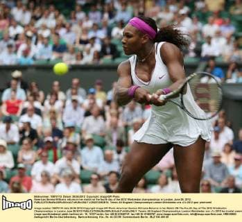American Serena Williams returns in her match on the fourth day of the 2012 Wimbledon championships in London, June 28, 2012.  LON2012062810