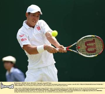 Japan s Kei Nishikori returns in his match on the fourth day of the 2012 Wimbledon championships in London, June 28, 2012.  LON2012062826