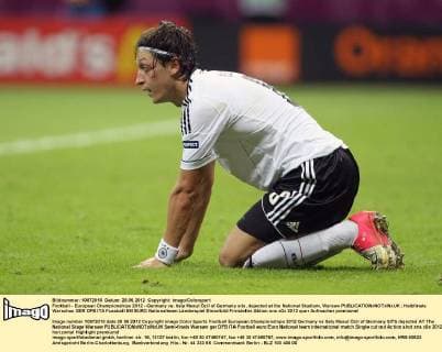 Football - European Championships 2012 - Germany vs. Italy Mesut Özil of Germany sits, dejected at the National Stadium, Warsaw 