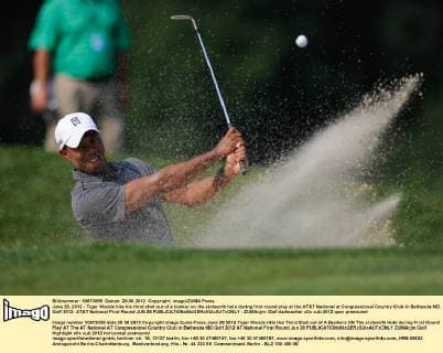 June 28, 2012 - Tiger Woods hits his third shot out of a bunker on the sixteenth hole during first round play at the AT&T National at Congressional Country Club in Bethesda MD. Golf 2012: AT&T National First Round JUN 28 - ZUMAcjm