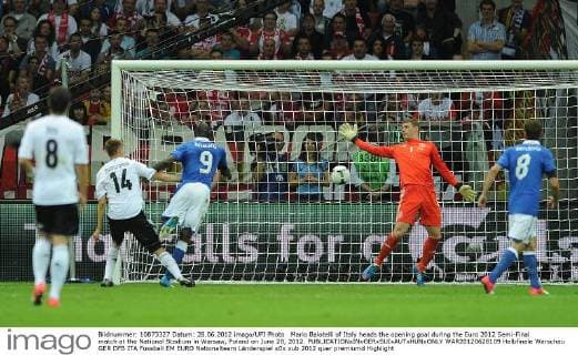 Mario Balotelli of Italy heads the opening goal during the Euro 2012 Semi-Final match at the National Stadium in Warsaw, Poland on June 28, 2012.  WAR20120628109