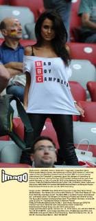 Polish model Natalia Siwiec, the hottest girl of Euro 2012 shows a T-shirt that reads at the front Bad Boy Cambell and at the back BBC is to mock former international Sol Campbell’s comments about the dangers of travelling to Poland and Ukraine, during The Euro 2012 football championships semi-final match Germany vs. Italy on June 28, 2012 at the National Arena in Warsaw, Poland.  EN_01035924_0005