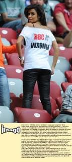 Polish model Natalia Siwiec, the hottest girl of Euro 2012 shows a T-shirt that reads at the front Bad Boy Cambell and at the back BBC is to mock former international Sol Campbell’s comments about the dangers of travelling to Poland and Ukraine, during The Euro 2012 football championships semi-final match Germany vs. Italy on June 28, 2012 at the National Arena in Warsaw, Poland.  EN_01035924_0008