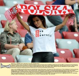 Polish model Natalia Siwiec, the hottest girl of Euro 2012 shows a T-shirt that reads at the front Bad Boy Cambell and at the back BBC is to mock former international Sol Campbell’s comments about the dangers of travelling to Poland and Ukraine, during The Euro 2012 football championships semi-final match Germany vs. Italy on June 28, 2012 at the National Arena in Warsaw, Poland.  EN_01035975_0018