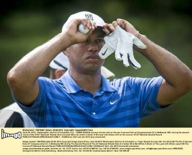 June 29, 2012 - Washington, District of Columbia, U.S. - TIGER WOODS surveys his tee shot on the par-3 second hole at Congressional CC in Bethesda, MD. during the second round of the AT&T National. Woods shot a 3-under 68 to be within 3 shots of the lead with others still on the course. AT&T National Second Round - ZUMAmv2