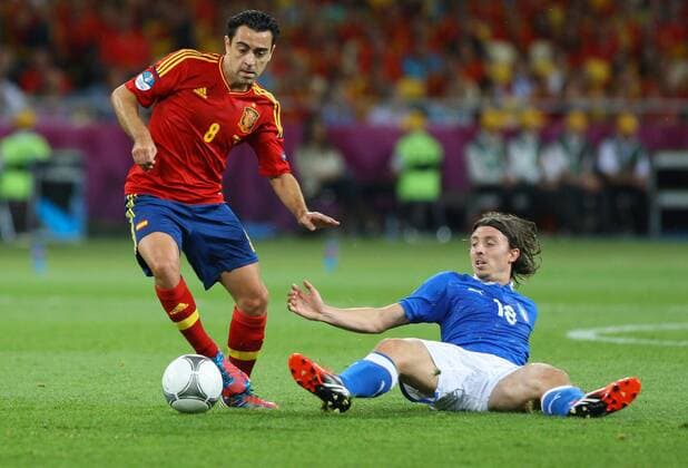 01.07.2012 Kiev, Ukraine. UEFA EURO 2012 final soccer match Spain vs. Italy at the Olympic Stadium in Kiev, Ukraine, 01 July 2012.XAVI HERNANDEZ (ESP), RICCARDO MONTOLIVO (ITA) xTOMASZxJASTRZEBOWSKIx  ActionPlus11298494