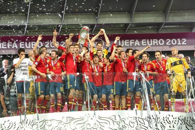 The final match of the European Football Championship 2012 between the national teams of Italy and Spain on July 1, 2012 in Kiev, Ukraine. National football team of Spain celebrates winning - Xavi Hernandez with Trophy EURO 2012 Cup in the final vs. Italy 4:0.  EN_01036398_0050