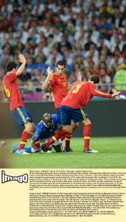 (From left) Sergio Busquets, Alvaro Arbeloa and Gerard Pique of Spain challenge Mario Balotelli of Italy in the final match of the UEFA European Football Championship 2012 in Kiev, Ukraine, 1 July 2012. Majestic Spain took their place among the games greats by thrashing Italy 4-0 to retain their European title on Sunday (1 July 2012), the biggest victory margin in a World Cup or Euro final, and all without a recognized striker. Their success rewrote the tactical handbook and the record books after goals from David Silva, Jordi Alba and late substitutes Fernando Torres and Juan Mata gave the world champions an ultimately easy victory over an Italian team down to 10 men through injury for the last half-hour. Spain routs Italy 4-0 to win Euro 2012 crown  pau671356_02