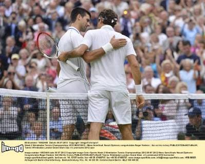 Week 2 Wimbledon Tennis Championships 2012 06 07 2012 - Mens Semifinal. Novak Djokovic congratulates Roger Federer - Sui on his victory 