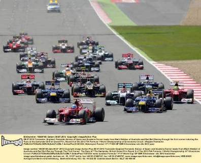 08.07.2012 Towcester, England. Fernando Alonso of Spain and Scuderia Ferrari leads from Mark Webber of Australia and Red Bull Racing through the first corner induring the Race at the Santander British Grand Prix, Round 9 of the 2012 FIA Formula 1 World Championship at Silverstone Circuit. xRoganxThomsonx  ActionPlus11301224