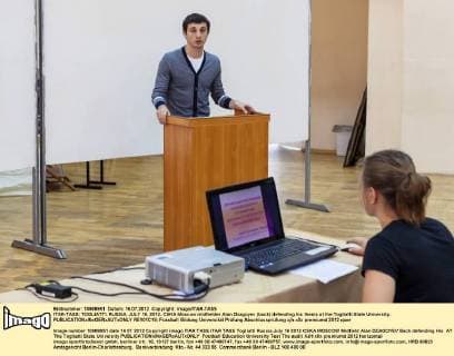 ITAR-TASS: TOGLIATTI, RUSSIA. JULY 16, 2012. CSKA Moscow midfielder Alan Dzagoyev (back) defending his thesis at the Togliatti State University.  RE101C18