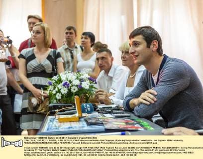 ITAR-TASS: TOGLIATTI, RUSSIA. JUNE 22, 2012. CSKA Moscow midfielder Alan Dzagoyev (R) during the graduation ceremony at the Togliatti State University.  RE101C1B