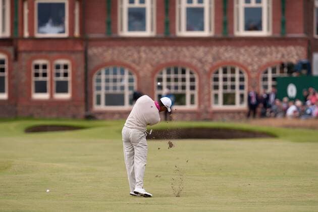 Golf - The Open - Day One Tiger Woods of USA plays a shot down the 18th fairway towards the club house at Royal Lytham & St Anne s Golf Club 