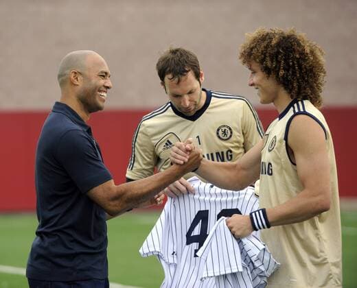 July 21 2012: New York Yankees pitcher Mariano Rivera autographs a jersey for Chelsea FC s Petr Cech 1 and David Luiz 4 during media interviews at the Chelsea FC training session at the Timex Performance Center in East Rutherford, New Jersey. Soccer 2012: Chelsea FC Training Session JUL 21 - ZUMAcw2